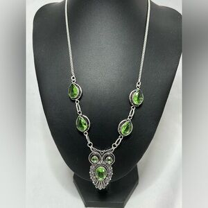 Silver owl necklace with peridot green colored glass stones